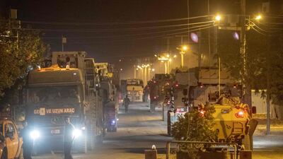 Turkish army soldiers drive towards the border with Syria near Akcakale in Sanliurfa province. AFP