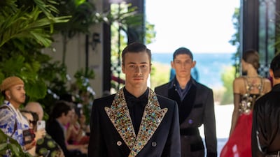 Elaborate, golden beadwork on the lapel of a double-breasted jacket