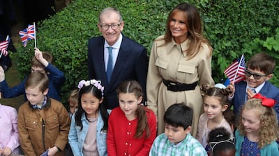 First lady Melania Trump and Theresa May's husband Philip attend a garden party at 10 Downing Street in London. Reuters