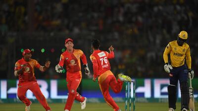 Luke Ronchi, second left, in action in the field during the PSL final. He would go on to hit a stunning half century to guide Islamabad United to victory. Asif Hassan / AFP