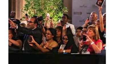 Fans snap photos as Richard Gere arrives at the Abu Dhabi Film Festival on Friday. The festival offers both hard-to-find movies and also a lively scene, a reader says. Lee Hoagland / The National