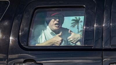 Donald Trump gives two thumbs up to supporters in Florida. Greg Lovett / Palm Beach Post via AP