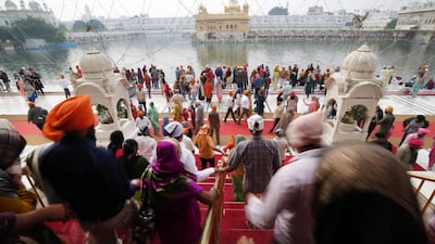 Devotees visit to pay obeisance at the Golden Temple, the holiest of Sikh places on the occasion of the 550th birth anniversary of the first Sikh Guru or master, Sri Guru Nanak Dev Ji in Amritsar, India. EPA