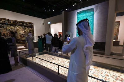 Visitors explore Spices and Wonders: Sailing the Indian Ocean at Louvre Abu Dhabi, featuring artworks and artefacts tracing centuries of trade and cultural exchange. Victor Besa / The National