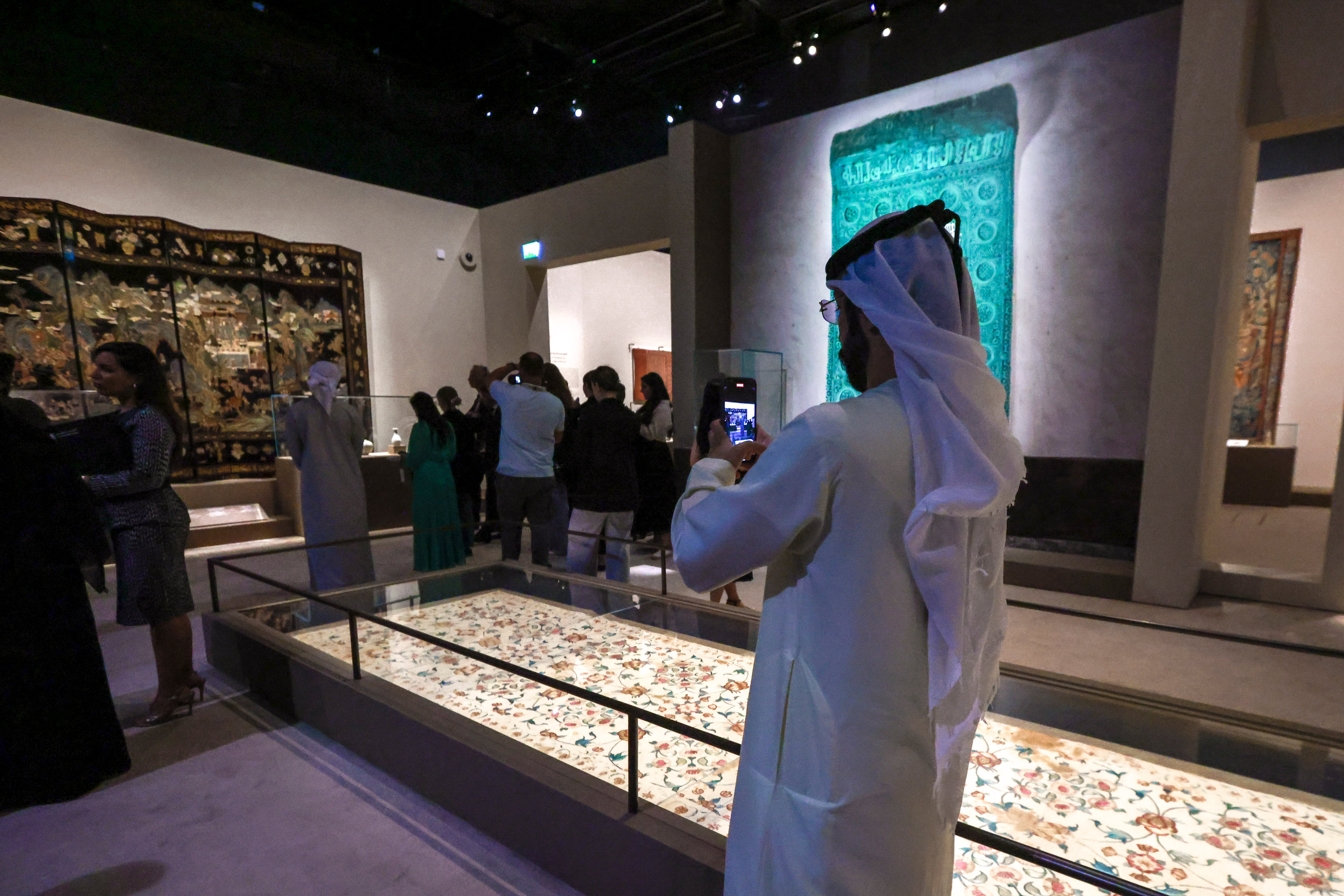 Visitors explore Spices and Wonders: Sailing the Indian Ocean at Louvre Abu Dhabi, featuring artworks and artefacts tracing centuries of trade and cultural exchange. Victor Besa / The National