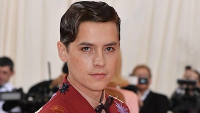 Actor Cole Sprouse wore a boldly embroidered shirt and contrasting sleeveless jacket for the event. AFP