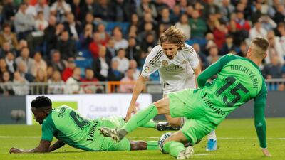 Luka Modric wins a penalty for Real Madrid after being fouled by Leganes' Kenneth Omeruo. Reuters