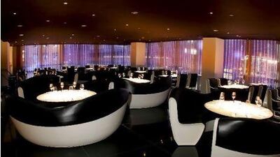 Tables are set for dinner service at Armani/Ristorante 5th Avenue in the flagship Armani store in New York, U.S., on March 15, 2009. Giorgio Armani, who has a Nobu branch in his Milan store, announced plans for this restaurant on the third floor of his Fifth Avenue store in New York in February 2009. Source: Armani via Bloomberg News EDITOR'S NOTE: NO SALES. EDITORIAL USE ONLY.