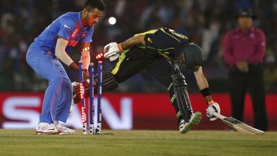 India’s Hardik Pandya (L) attempts unsuccessfully to run out Australia’s Glenn Maxwell. REUTERS/Adnan Abidi