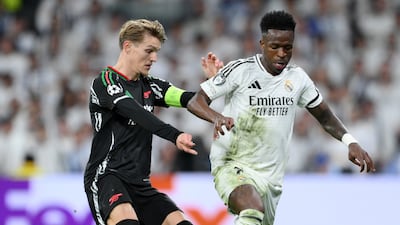 Martin Odegaard of Arsenal and Vinicius Junior of Real Madrid battle for possession during the 2024/25 Champions League quarter-final. Getty Images