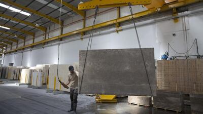 Inside the Nassar Stone factory, large slabs of limestone known as Jerusalem stone are seen on the production line. The factory uses the latest technology and imports their machines from Italy.