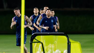 Lionel Messi with teammates during training. Reuters