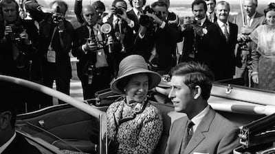 Queen Elizabeth and Prince Charles travel in an open top car in Avignon during a state visit to France, in 1972. Getty Images