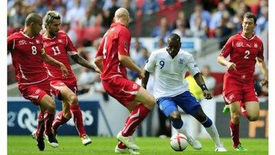 Darren Bent can find no way through the Switzerland defence at Wembley Stadium.