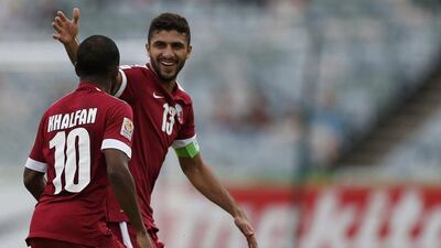 Qatar's Khalfan Ibrahim, left, celebrates scoring the opening goal on Sunday against the UAE in his side's eventual 4-1 Asian Cup loss. Tim Wimborne / Reuters