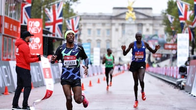 Shura Kitata of Ethiopia crosses the line in first place ahead of Vincent Kipchumba of Kenya in the Elite Men’s race during the 2020 London Marathon around St. James's Park on Sunday. Getty