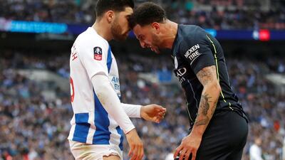 Brighton's Alireza Jahanbakhsh clashes with Manchester City's Kyle Walker. Reuters