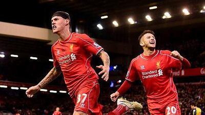 Liverpool's Martin Skrtel, left, celebrates scoring his team's second equalising goal during their English Premier League football match against Arsenal at Anfield in Liverpool, Northwest England, on December 21, 2014. AFP PHOTO / PAUL ELLIS