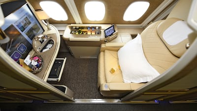 The first-class suites on Emirates feature cream leather seats and a light wood finishing. Photo: Emirates