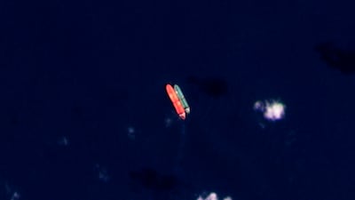 A satellite image shows vessels identified as the Virgo, left, and the Suez Rajan in the South China Sea in February last year. AP