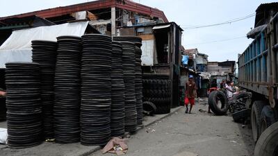 In the Smokey Mountain slum area, old tyres are bought from lorry owners and sold to fishermen who use them for their nets.