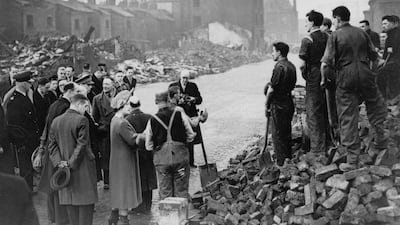 King George VI and Queen Elizabeth during an inspection of air-raid damage in Manchester, during the Blitz of the Second World War, 1941. Getty Images