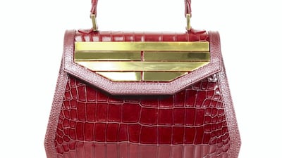 Rula Galayini: Strawberry-hued mock croc is toughened up with golden hardware on this bold day bag