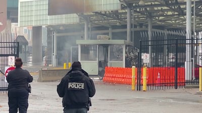 Police officers view the scene after the vehicle explosion at Niagara Falls. Reuters