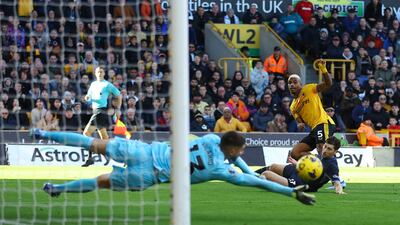 Tottenham Hotspur's Guglielmo Vicario saves from Wolverhampton Wanderers' Mario Lemina. Reuters