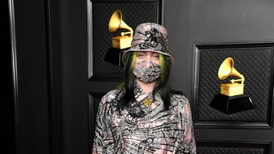 Multiple Grammy nominee Billie Eilish wore a pink Gucci outfit with black sequins and matching gloves, hat and mask. EPA