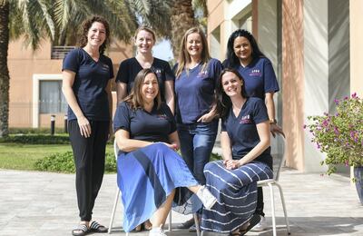 The Music Monkeys team in Abu Dhabi, anti-clockwise from bottom left: founder Lisa Irwin, director Bethany Lowe, Ronda Martin-Chowdhari, Mary Hollingworth, Rachel Robertson and Sophie Allen. Khushnum Bhandari for The National
