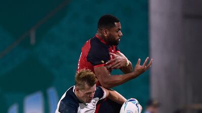 England's Joe Cokanasiga battles with Will Hooley of the US. Reuters