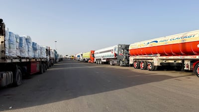 Lorries carrying humanitarian aid and fuel form a queue on the Egyptian side of the Rafah border crossing into the Gaza Strip. Reuters