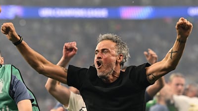 PSG coach Luis Enrique celebrates after winning the Champions League. Reuters