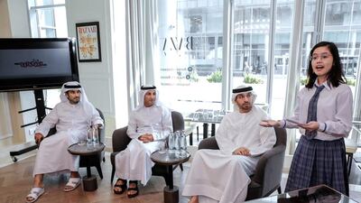 Mohammed Al Shehhi, chief operating officer of Dubai Design District, Abdulla Al Karam, director general of KHDA, Saeed Al Nabouda, acting director general of Dubai Culture and Arts Authority and a pupil of The Philippine School Dubai, announce the start of the second season of Saturday Club. Victor Besa for The National