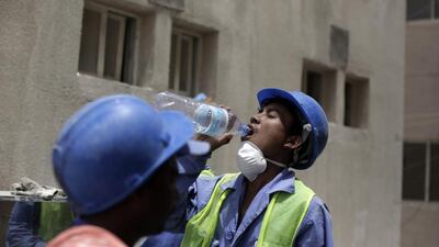 File photo taken during a government-organised media tour on May 3, 2015 shows Nischal Tamang, a labourer from Nepal, taking a break from his work in Doha, Qatar. Maya Alleruzzo/AP Photo