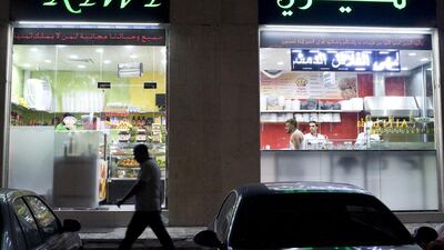 Kiwi Cafeteria is one of the two restaurants in Khalidiya that are offering free meals to those who cannot afford to dine out. Delores Johnson / The National