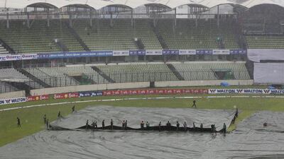 Bangladeshi ground staff pull covers on the field as it rains on the fourth day of the second Test between Bangladesh and South Africa on Sunday. On Monday the match ended in a draw. AM Ahad / AP / August 2, 2015
