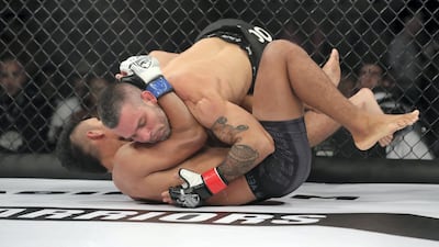 Fabio Mello (black gloves) takes on Mark Alcoba in the catchweight division. Chris Whiteoak / The National