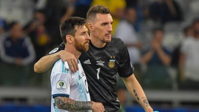 Argentina's Lionel Messi and goalkeeper Franco Armani greet each other after the match. AFP
