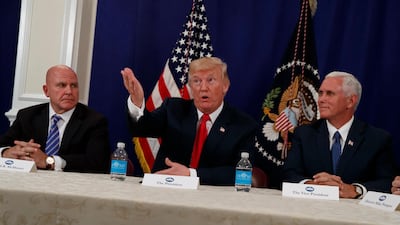 US president Donald Trump, flanked by his national security Adviser H R McMaster, left, and vice president Mike Pence, speaks to reporters after a security briefing at Trump National Golf Club in Bedminster, New Jersey on August 10, 2017. Evan Vucci / AP Photo