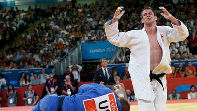 Canada's Antoine Valois-Fortier reacts after defeating United State's Travis Stevens in a bronze medal match during the men's 81-kg judo competition. Paul Sancya / AP Photo