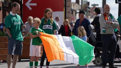 People line the streets as the funeral cortege of Jack Charlton passes through his hometown of Northumberland in Ashington on Tuesday. EPA