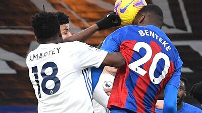Leicester City's Daniel Amartey, left, appears to handle the ball as Crystal Palace's Christian Benteke attempts a header. PA