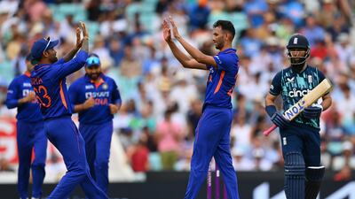 India's Prasidh Krishna, right, celebrates after taking the wicket of Moeen Ali for 47. Getty