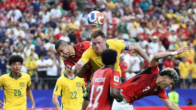 Egypt's Ramy Rabia, left, Emam Ashour, right, battle for a header with Australia defender Harry Souttar. AFP