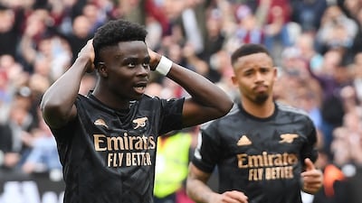 Arsenal's Bukayo Saka reacts after missing a penalty against West Ham United. EPA