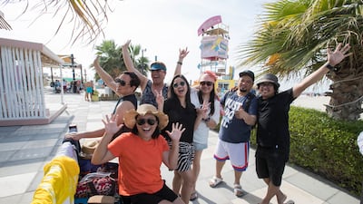 A Filipino Family and friends spend at Kite Beach, Jumeirah Beach Road, in Dubai. Ruel Pableo for The National