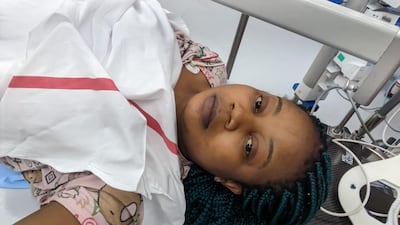 Ms Claire in hospital after escaping the fire. Photo: Yemdzu Doris Claire