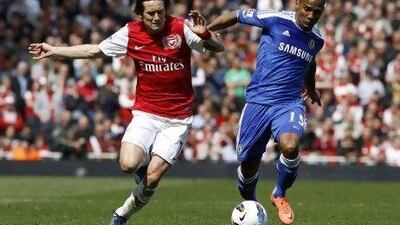 Arsenal's Tomas Rosicky challenges Chelsea's Florent Malouda.